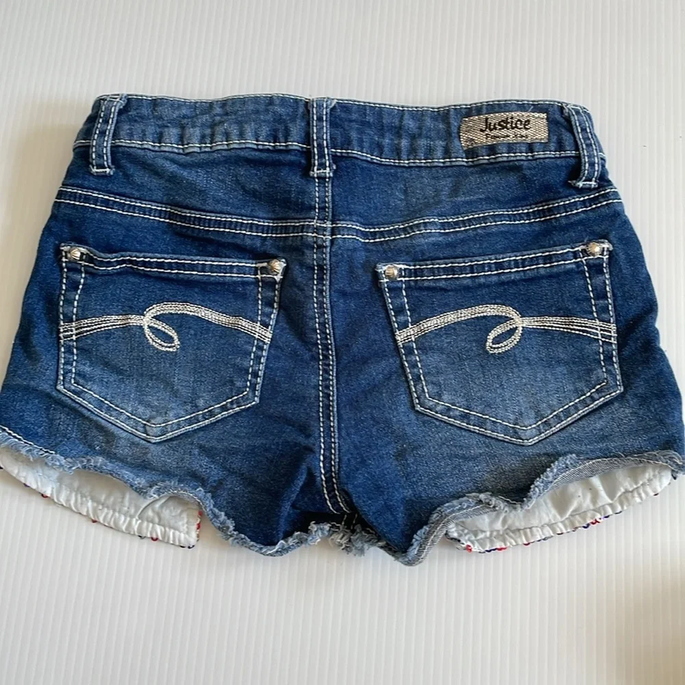 Justice denim jean shorts with red, blue & silver sequins. Girls size 10